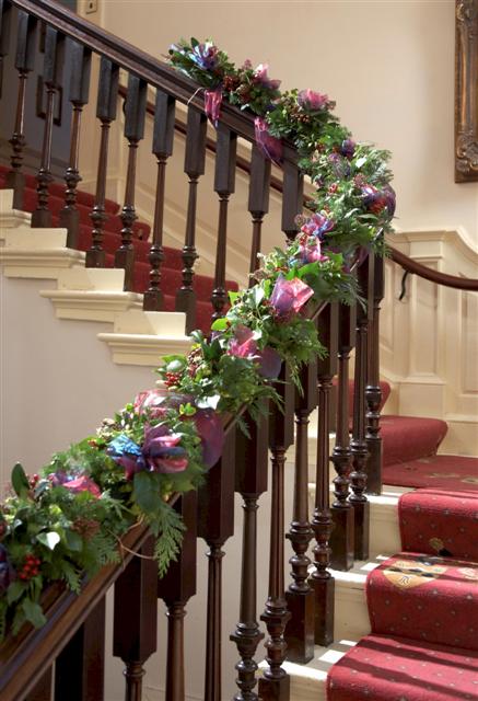 Oasis garland displayed on a elegant railing