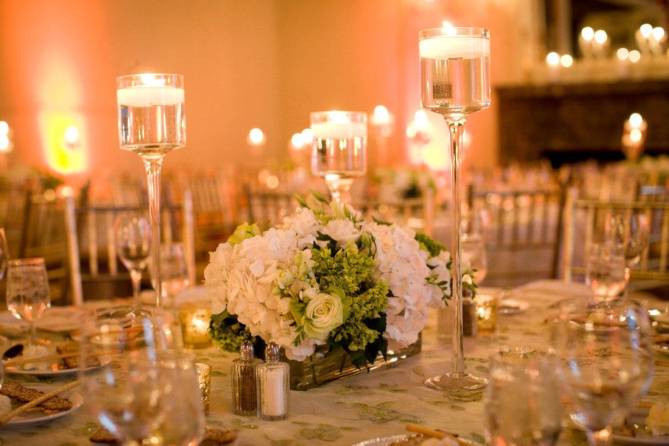 Glass candle holders on table in elegant wedding